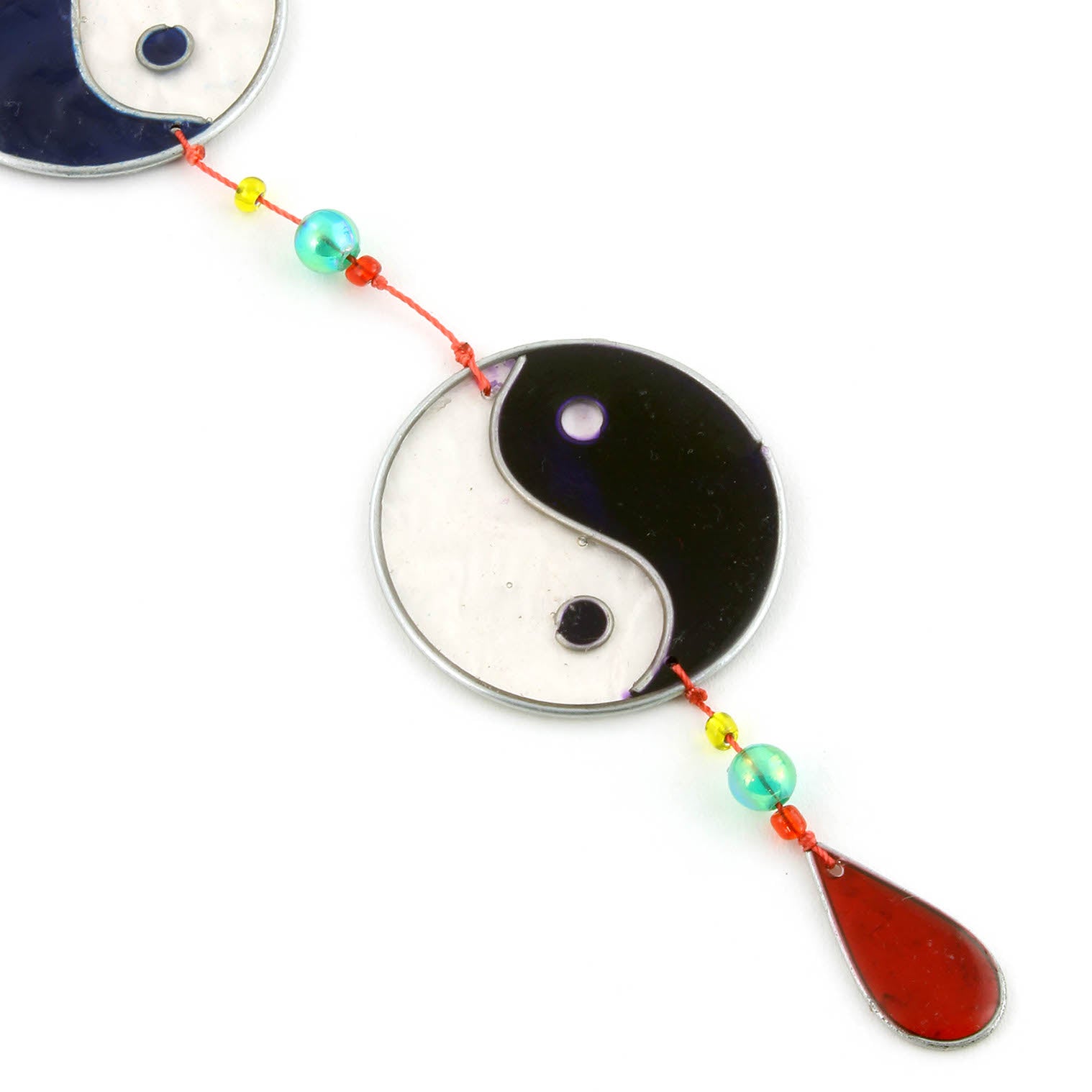 Vertical string of five yin yang suncatchers in contrasting colour pairings, with coloured beads strung between the discs