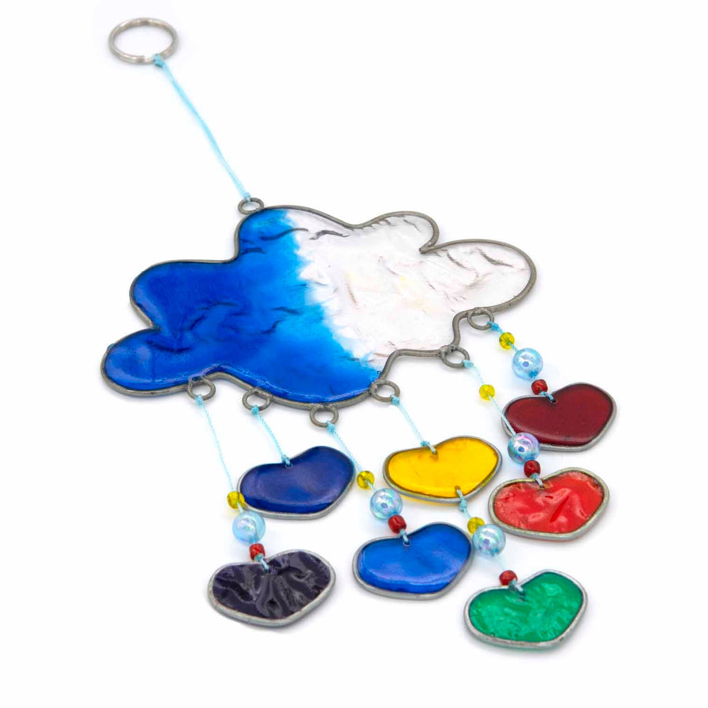 Blue resin cloud suncatcher with six threads of rainbow hearts dangling beneath in jewel tones of red, orange, yellow, green, blue and purple