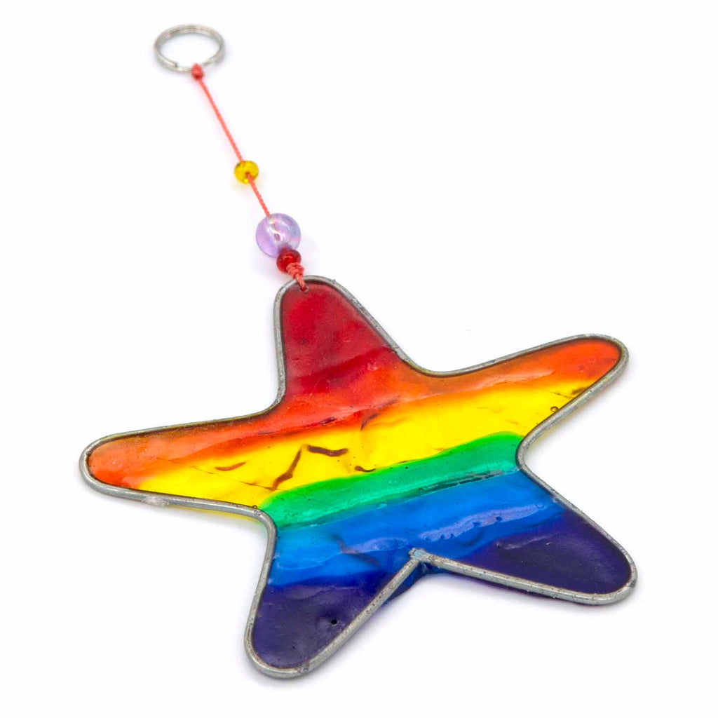 Small star-shaped suncatcher with a bright rainbow stripe running across it, in a soldered metal frame