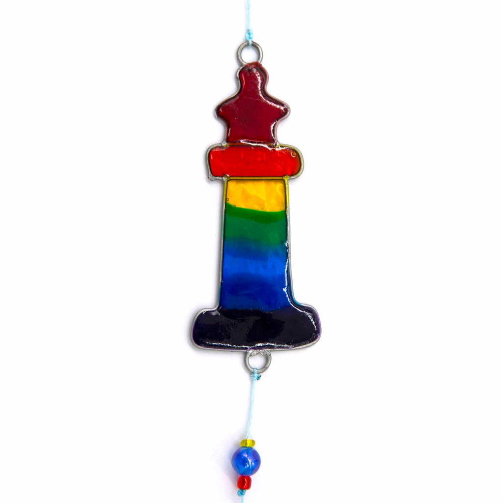 Nautical hanging suncatcher with a blue seahorse, a deep blue anchor and a red striped lighthouse strung vertically in soldered metal frames