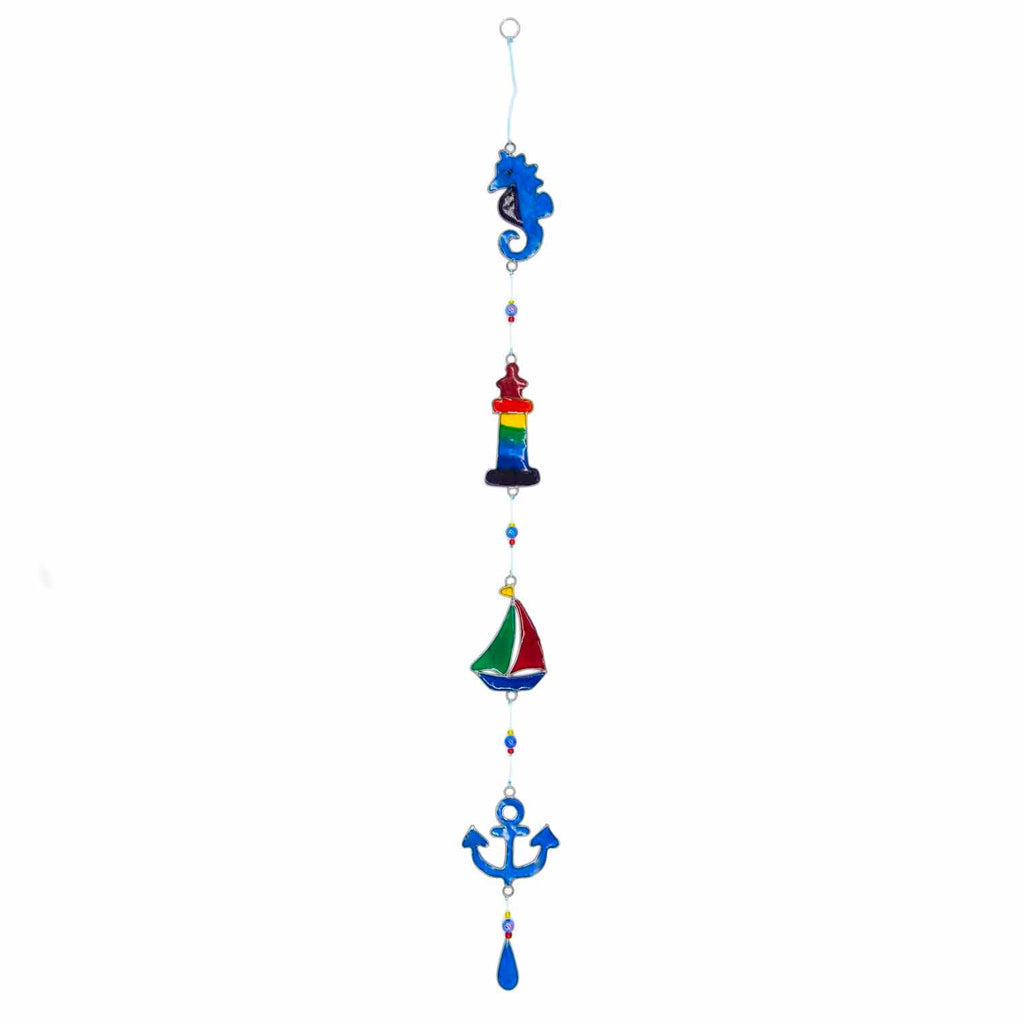 Nautical hanging suncatcher with a blue seahorse, a deep blue anchor and a red striped lighthouse strung vertically in soldered metal frames