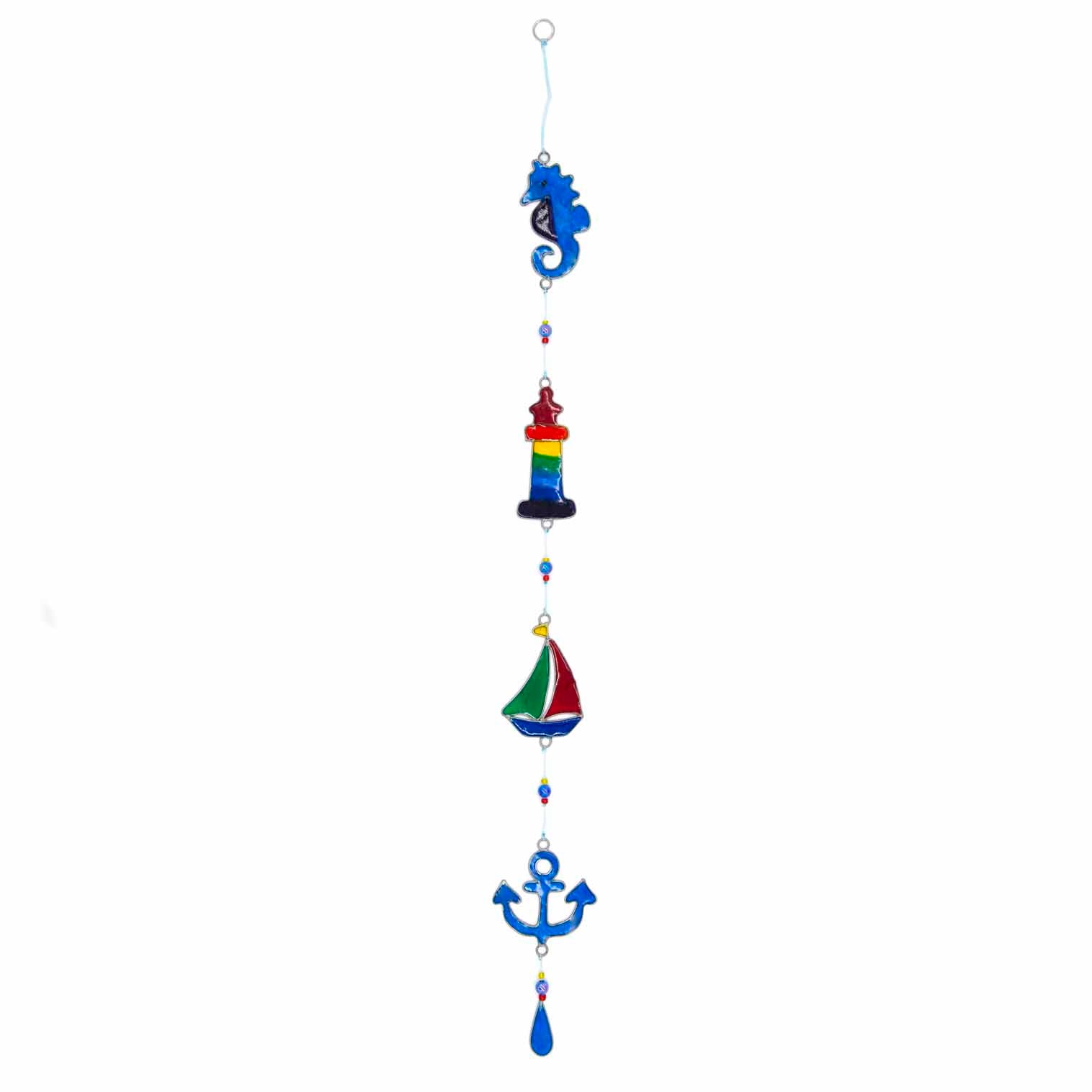 Nautical hanging suncatcher with a blue seahorse, a deep blue anchor and a red striped lighthouse strung vertically in soldered metal frames