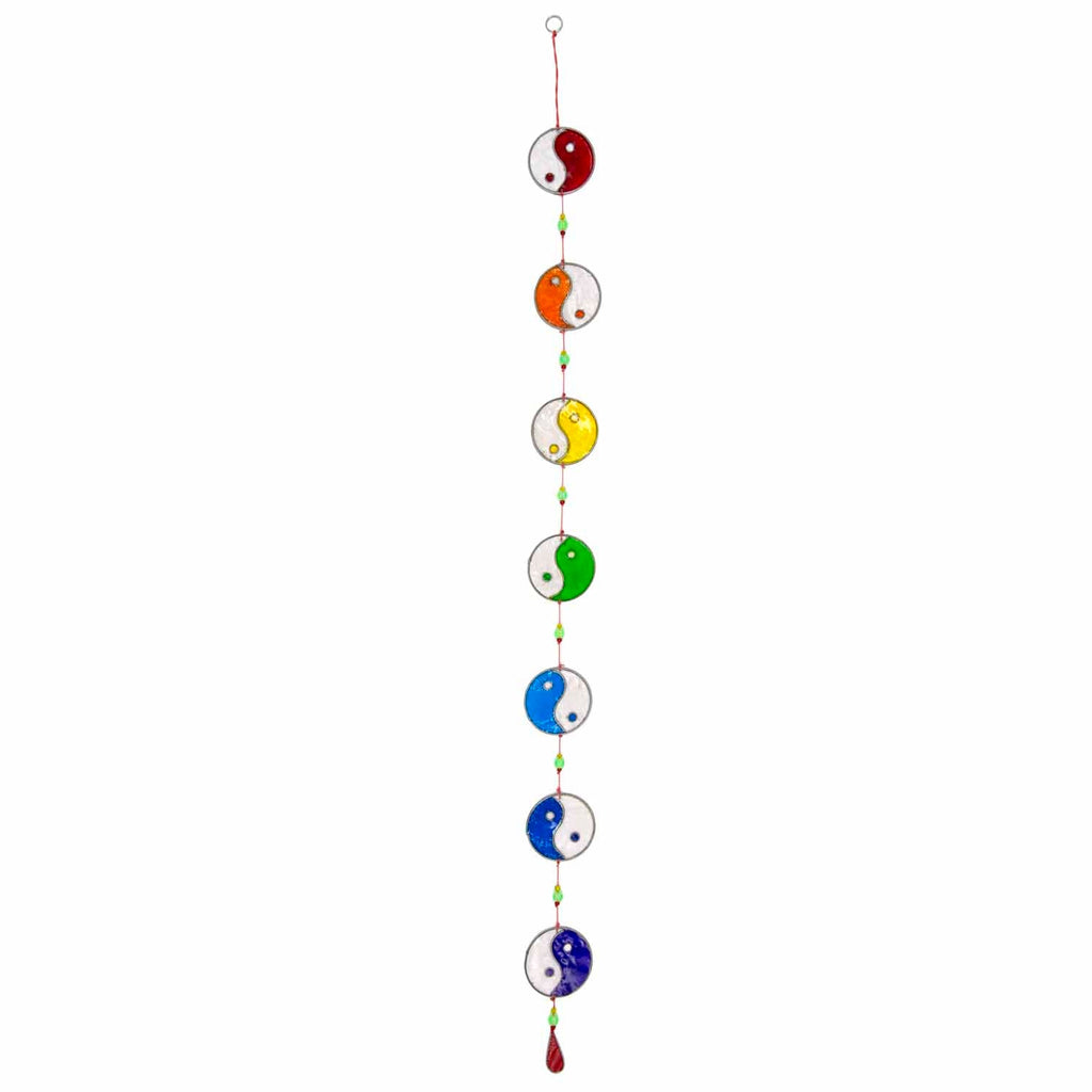 Vertical string of five yin yang suncatchers in contrasting colour pairings, with coloured beads strung between the discs