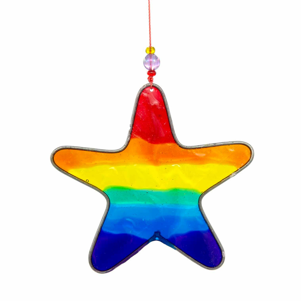 Small star-shaped suncatcher with a bright rainbow stripe running across it, in a soldered metal frame