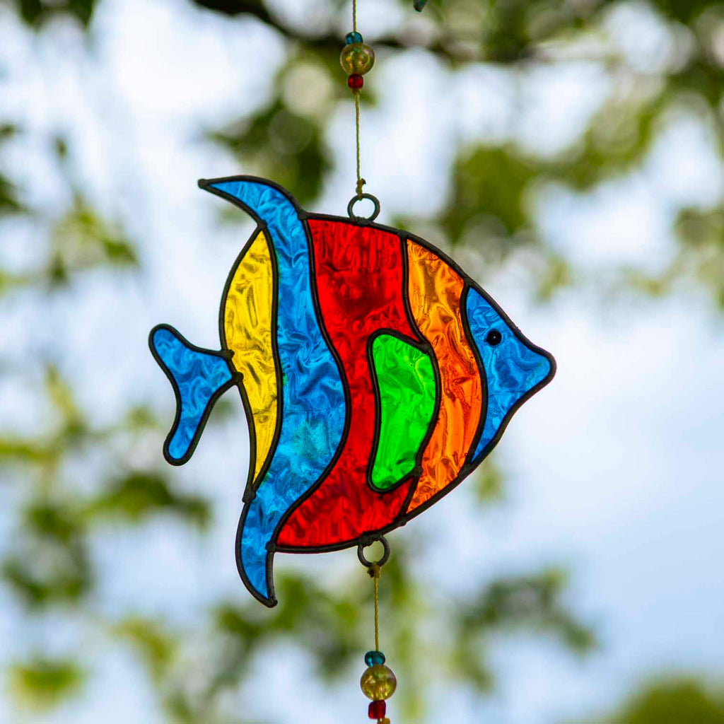 Vertical string of three angel fish suncatchers in bright turquoise, cobalt, lime and ruby, in soldered metal frames