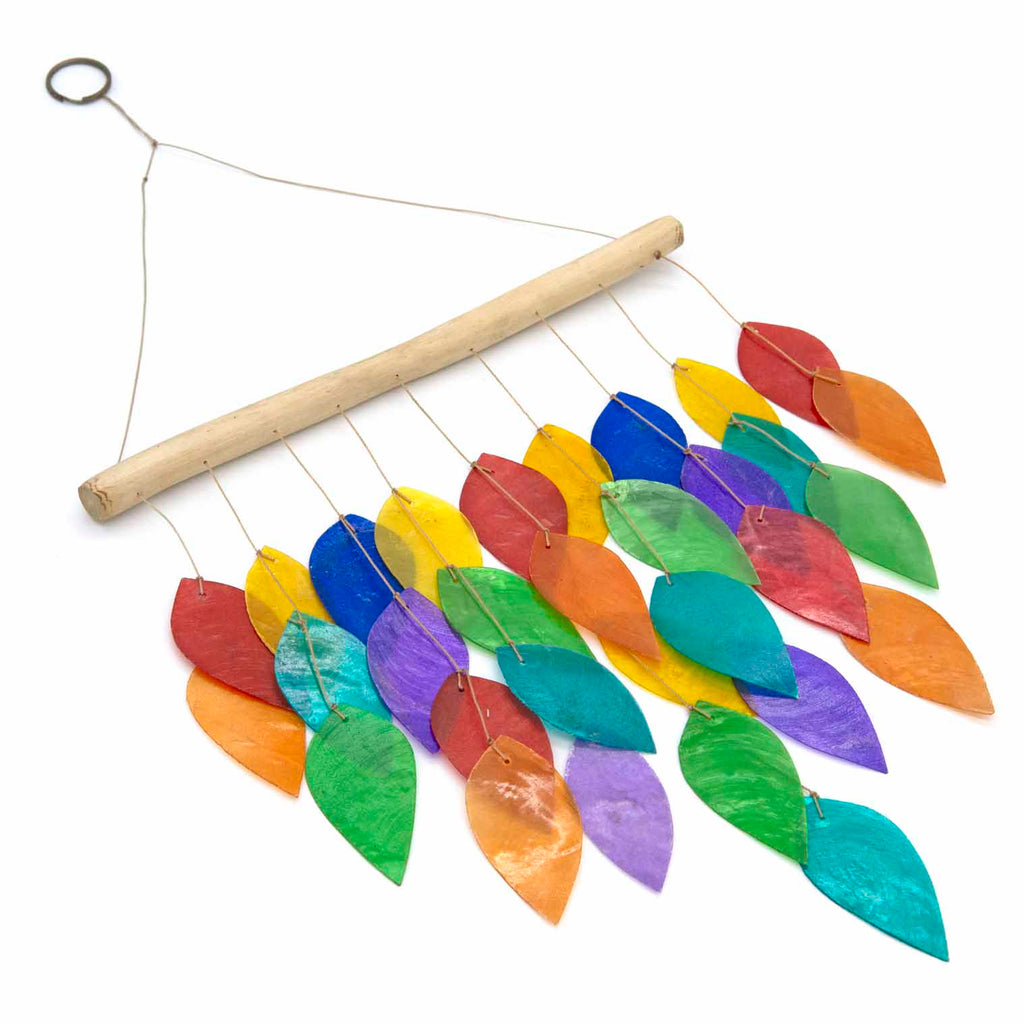 Hanging windchime of rainbow-coloured shell leaves strung from a length of bamboo
