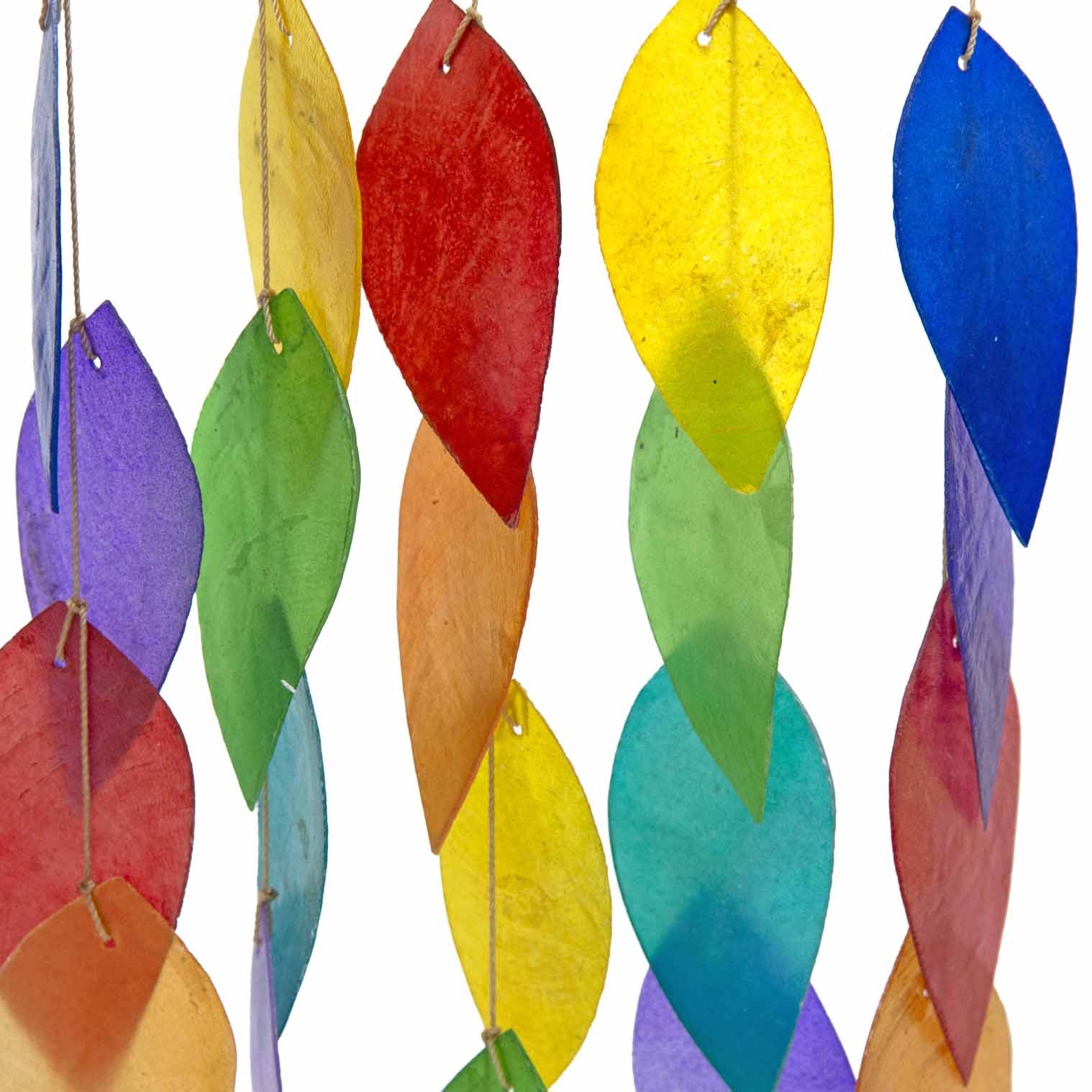 Hanging windchime of rainbow-coloured shell leaves strung from a length of bamboo