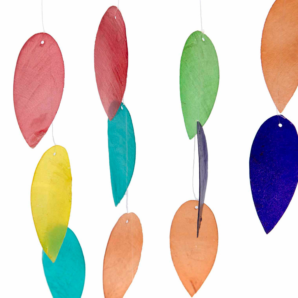 Hanging decoration with jewel-tone shell leaves dangling beneath a carved bamboo lotus flower