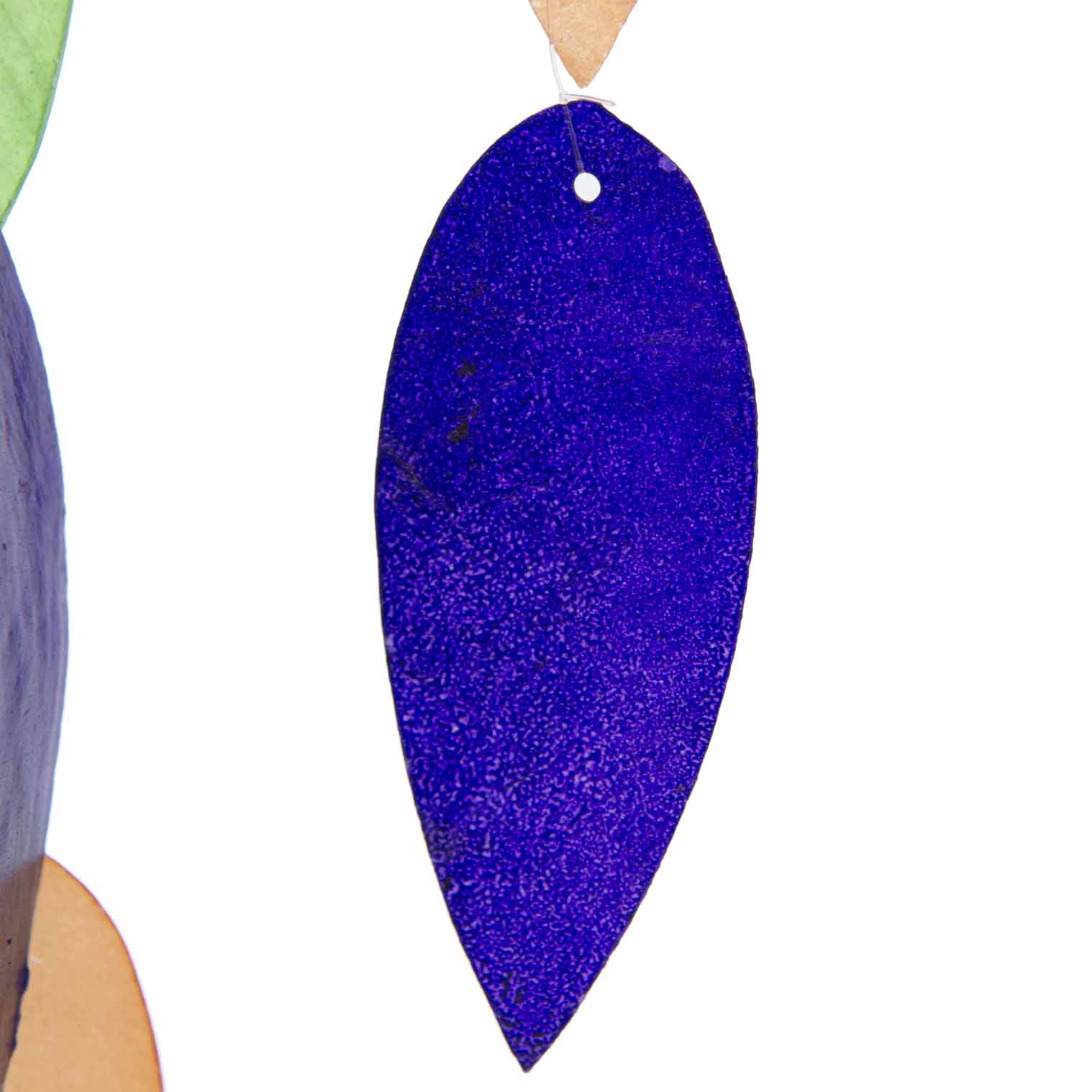 Hanging decoration with jewel-tone shell leaves dangling beneath a carved bamboo lotus flower