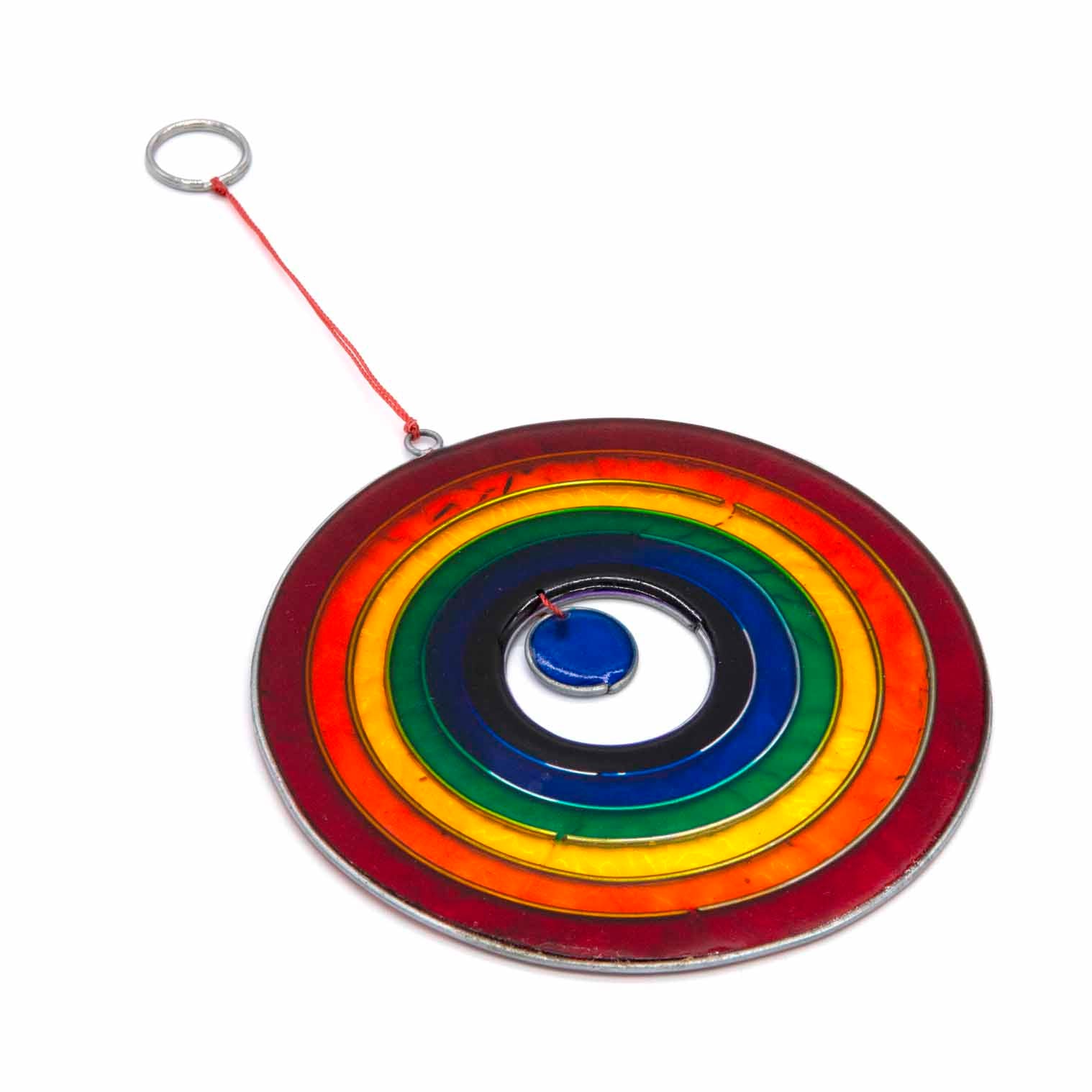 Round suncatcher with concentric rings of rainbow colour radiating from a deep blue centre, in a soldered metal frame