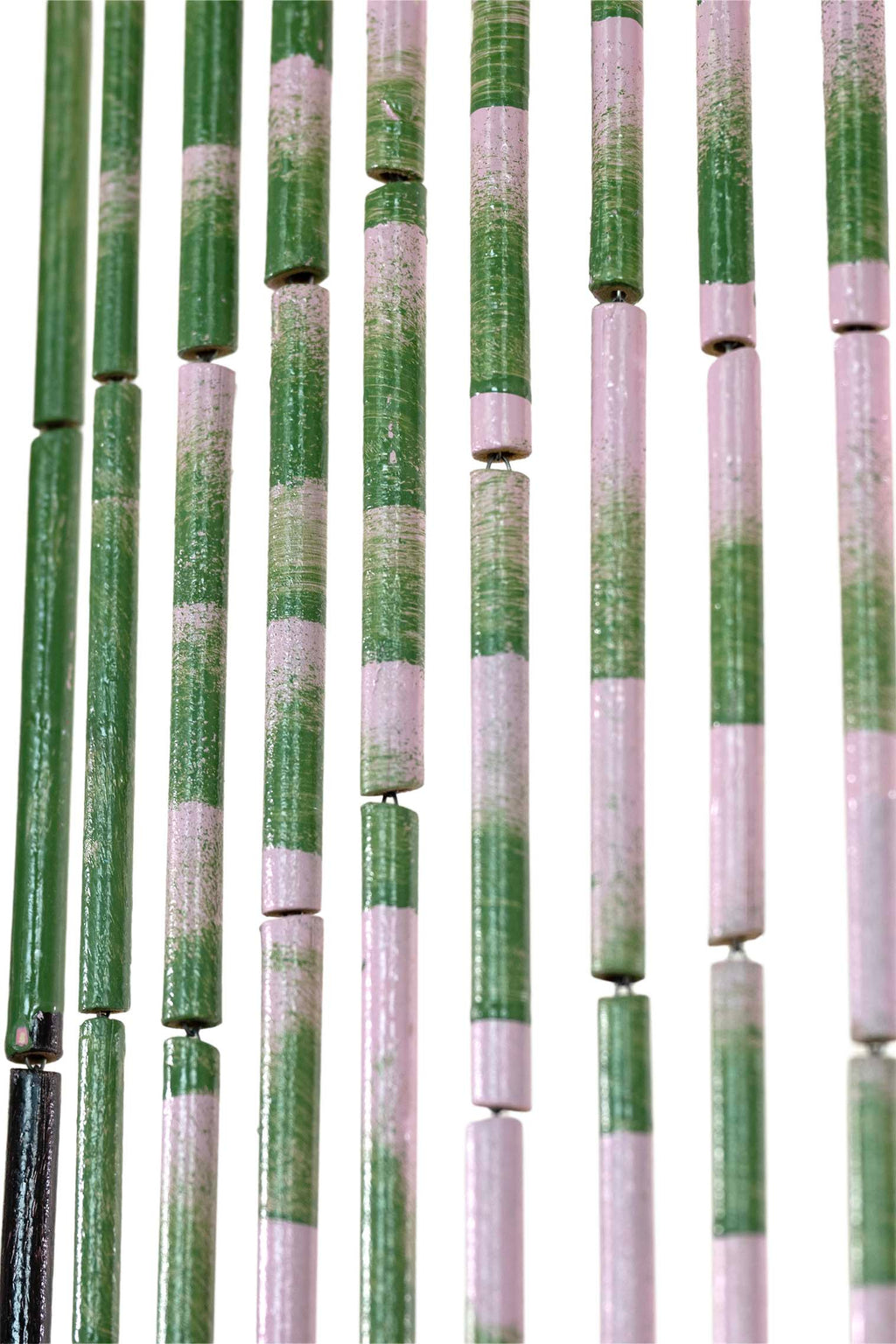 Hand-painted bamboo bead curtain with a bold pink flamingo design, hanging in a doorway
