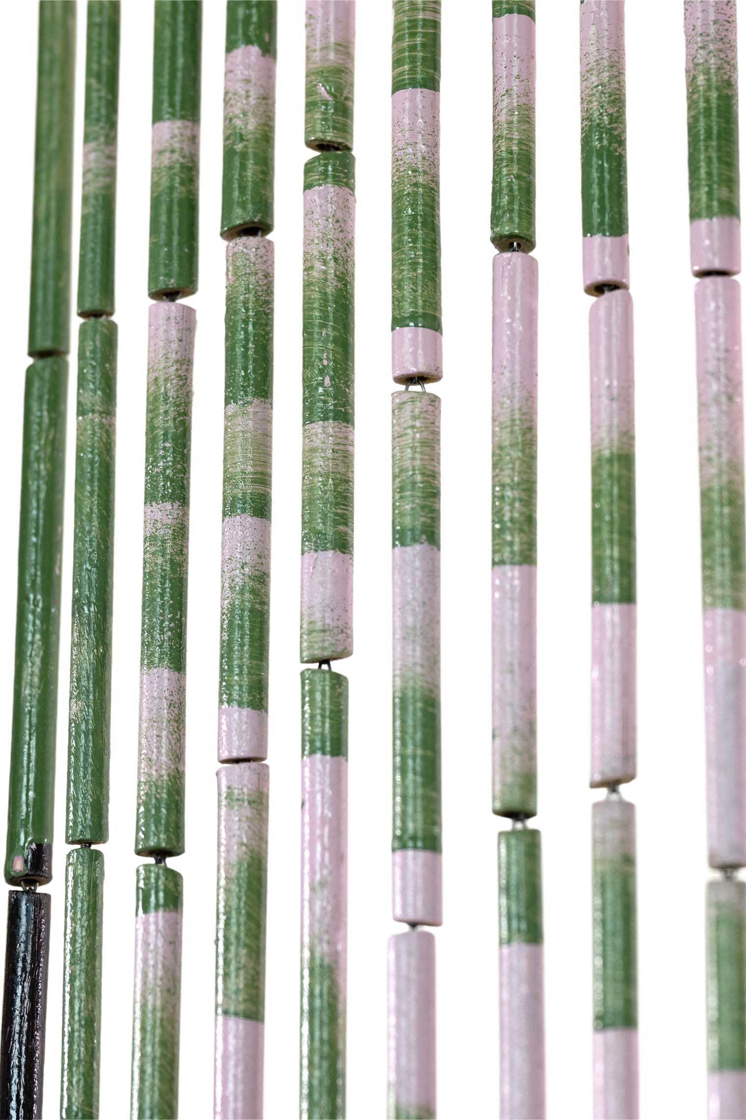 Hand-painted bamboo bead curtain with a bold pink flamingo design, hanging in a doorway