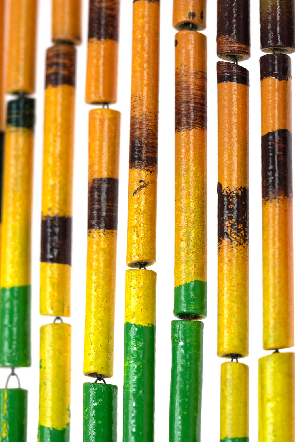 Hand-painted bamboo bead curtain with a bright yellow sunflower design, hanging in a doorway