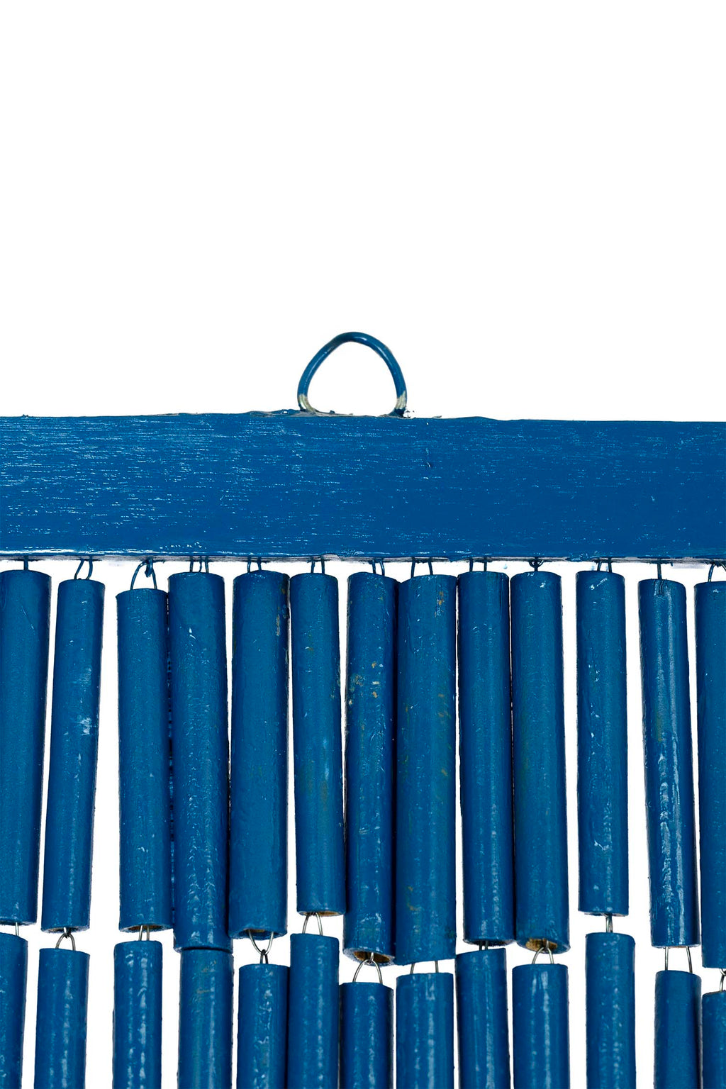 Hand-painted bamboo bead curtain showing a tropical sunset with palm tree silhouettes, hanging in a doorway
