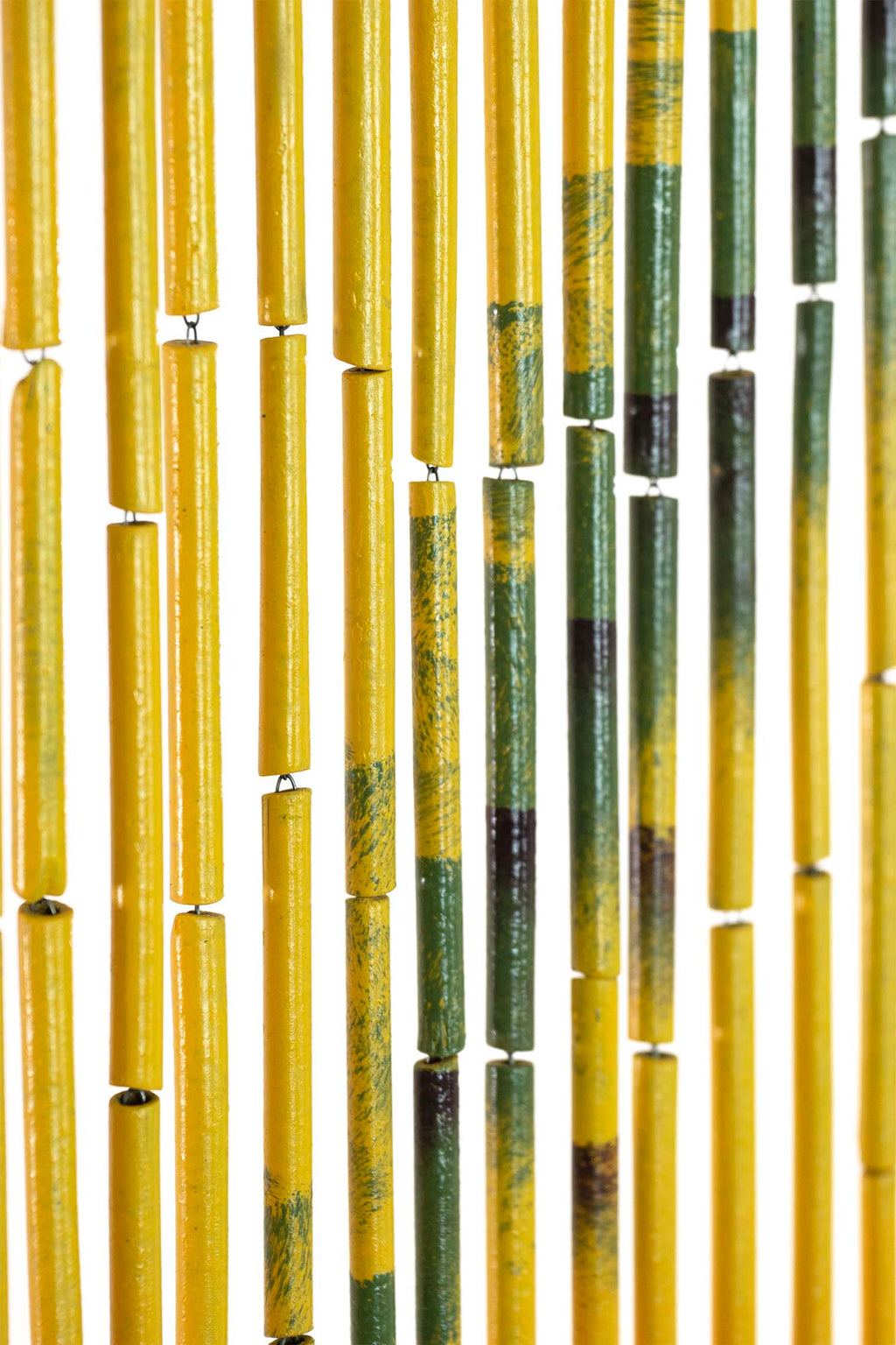 Hand-painted bamboo bead curtain showing a tropical sunset with palm tree silhouettes, hanging in a doorway
