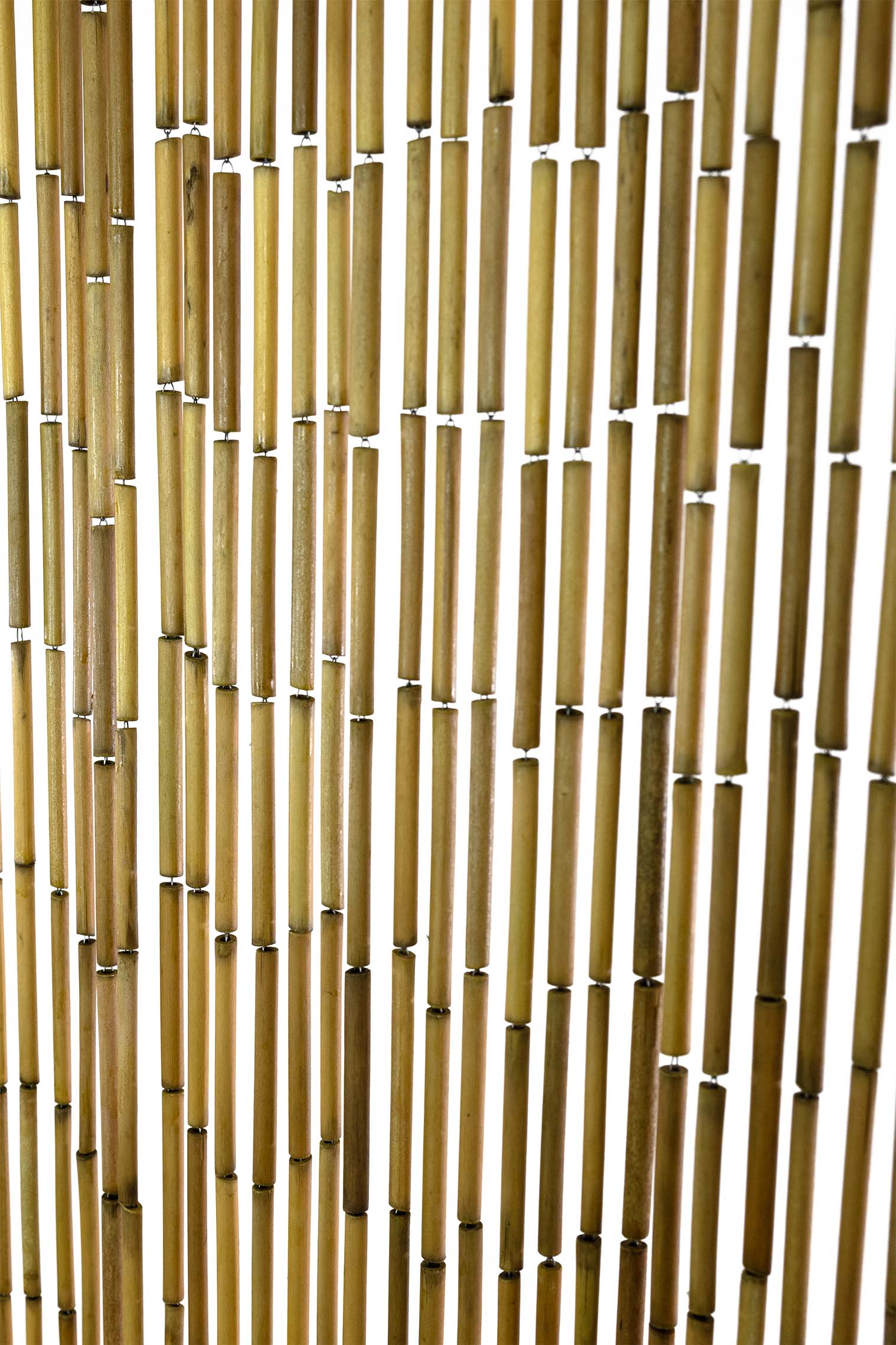 Natural unpainted bamboo bead curtain in warm raw bamboo tones, hanging in a doorway